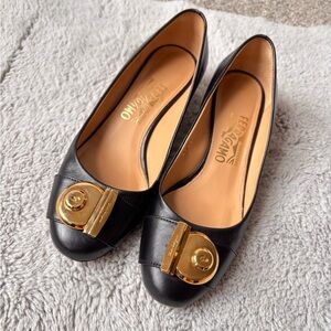 Salvatore Ferragamo Black mid heel with Gold Accent.